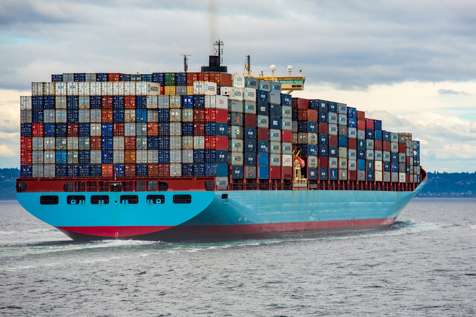 Container ship loaded with stacked shipping containers